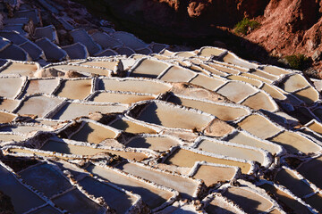 The beautiful landscapes and the stunning view of salt pans of Maras at sunset, Sacred Valley, Peru 