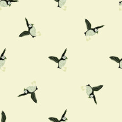 Fototapeta premium Seamless pattern in minimalistic style with decorative puffin print. Pastel background. Arctic animal backdrop.