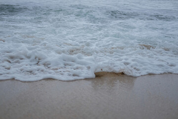 The beautiful blue waves of the beach in Gunungkidul