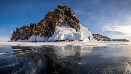 Fototapeta na wymiar Ice-covered rock on Oltrek Island. Winter Baikal