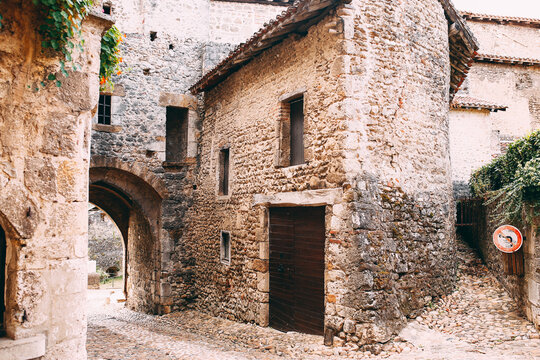 Facade of old stone buildings in Perouges, France