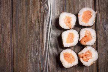 with sushi chopsticks ginger delicacy wooden background meal