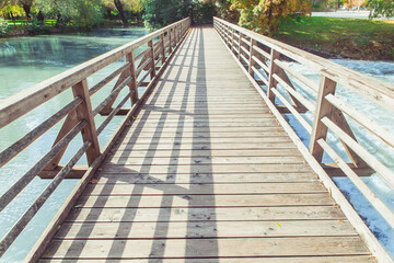 Fototapeta na wymiar Wooden footbridge over the Pivka river in Slovenia