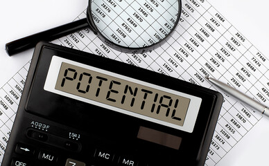 Word POTENTIAL on the calculator. Business and tax concept.