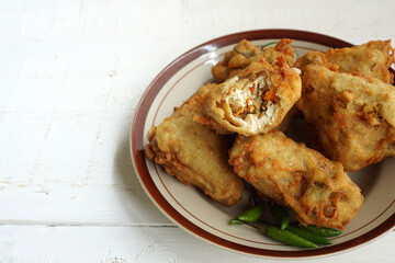 Indonesian traditional snack made from fried tofu and vegetables called `tahu susur`. Stuffed tofu from Indonesia.