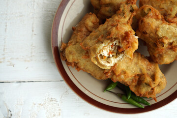 Indonesian traditional snack made from fried tofu and vegetables called `tahu susur`. Stuffed tofu from Indonesia.