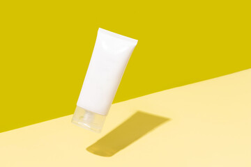 Creative layout with levitating beauty product on yellow background