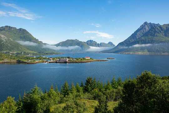 Sildpollnes church on the Sildpollneset peninsula, V&aring;gan, Lofoten, Norway with a view over fjord to the mountains
