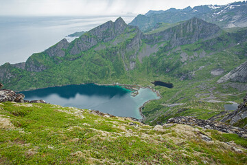 Fototapeta na wymiar Mountain lake by the Reinebringen hiking trail at Lofoten islands, Norway