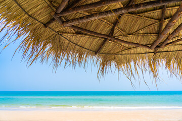 Empty deck chair lounge with umbrella around on beach sea ocean