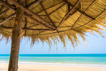 Empty deck chair lounge with umbrella around on beach sea ocean