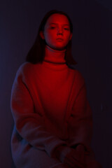 woman in the dark. red light
