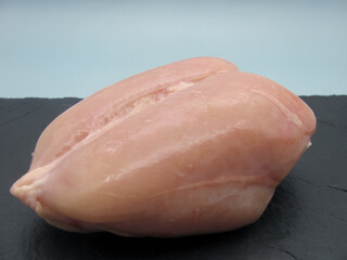 Fresh raw chicken breast on the bone without skin.