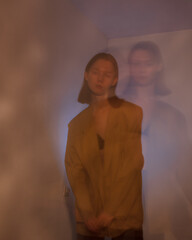 young woman in dark. different lights. defocus
