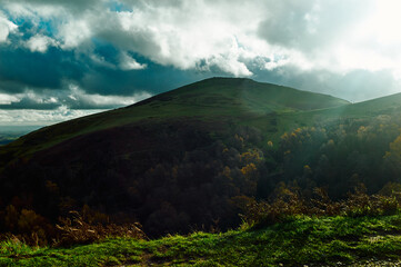 Obraz na płótnie Canvas Sunshine over the hills in the countryside on an autumn day