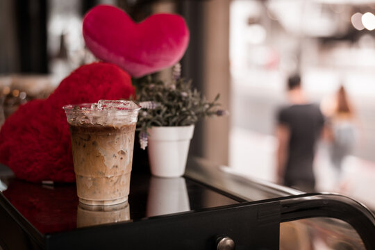 glass of coffee with milk on the table, valentine theme