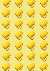 A pattern of yellow cups on a light yellow background.