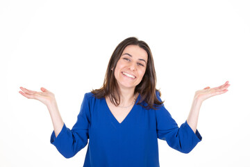 Young woman over isolated white background holding copyspace imaginary on the palm to insert an product advertising