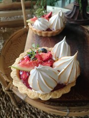 Red berry tarts consist of many colourful healthy berries.