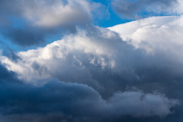 Dramatic thunderstorm clouds in blue sky before rain. Natural weather background