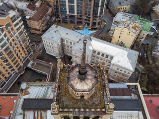 House with a five-pointed star on a spire in the center of Kiev. Aerial drone view. Winter cloudy morning.