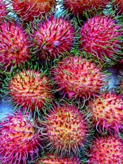 Rambutan fruit that is ripe is red