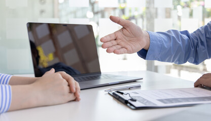Fototapeta premium Employer or HR leader is interviewing participants, applying for a company employee, and having read the proficiency test resume to recruit qualified employees, Selection of job applicants.