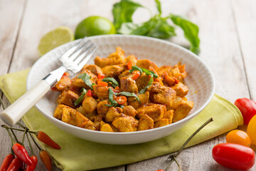 chicken stewed with tomatoes and red hot chili pepper