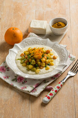 italian gnocchi with cheese cream and orange peel