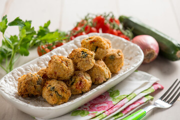 vegetarian meat ball with rice zucchinis and tomatoes