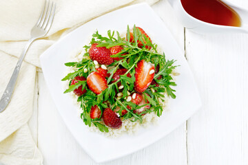 Salad of strawberry and couscous on board top