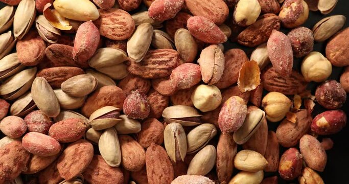 Assorted healthy organic nuts rotating