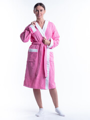 woman in a Bathrobe on an isolated white background with a smile on her face.