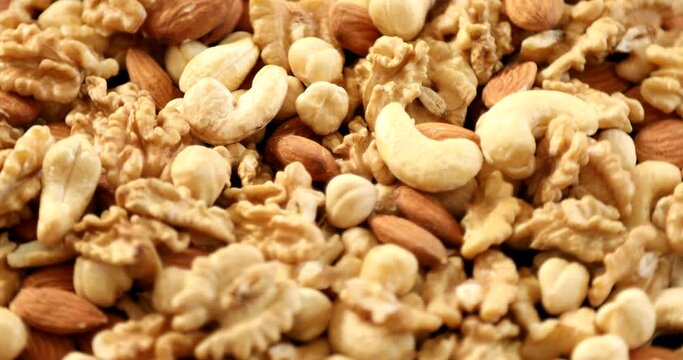 Assorted healthy organic nuts rotating