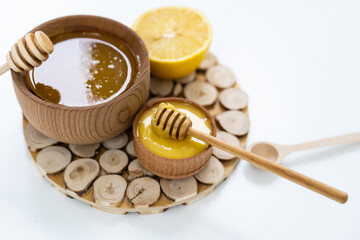 honey and lemon on white - alternative medicine