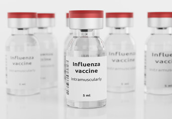 flu vaccine in vial on white background