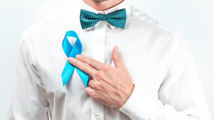 Blue prostate ribbon. Awareness cancer of men health. Hipster men in bright shirt, cyan bowtie with...