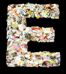 capital letter  E  made up of old newspaper