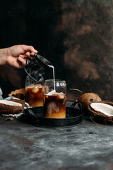 Iced coffee and coconut milk in a transparent glass