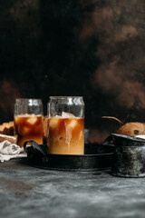 Iced coffee and coconut milk in a transparent glass