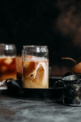 Iced coffee and coconut milk in a transparent glass