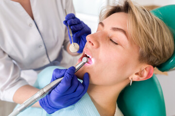 Woman at the dentist consultation. Checking and dental treatment in a clinic