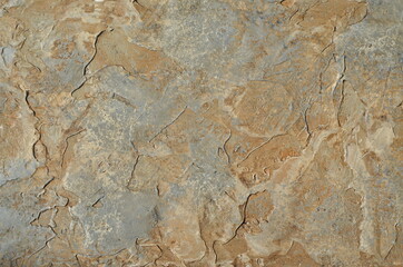 stone wall texture. texture of stone, dark, brown and gray wall. rough, cracked multi-colored base.
decorative plaster. stucco