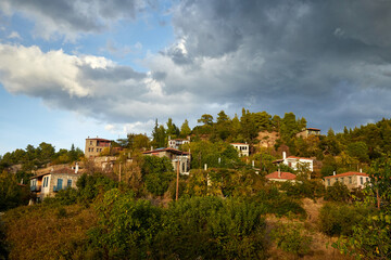 Fototapeta premium Parthenonas mountain Village under dramatic sky, Sythonia, Halkidiki peninsula, Greece