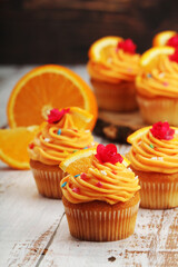 Cupcakes with orange icing on top