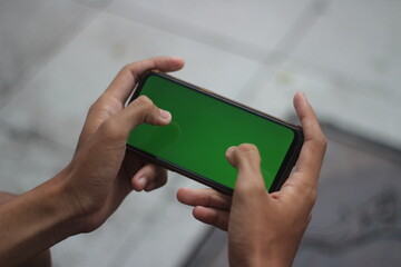 photo about playing online games on green background