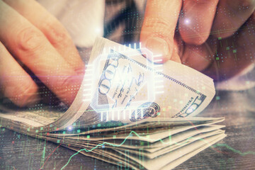 Double exposure of technology drawing hologram and us dollars bills and man hands. Data concept