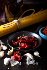 Raw pasta spaghetti dried hot red pepper, garlic and olive oil. Pasta sauce ingredient.