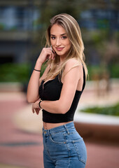 Portrait of young woman at outdoors.