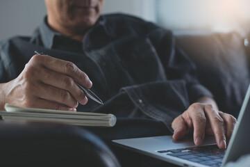 E-learning, online study, learn from home concept, man student studying online class, via laptop computer at home